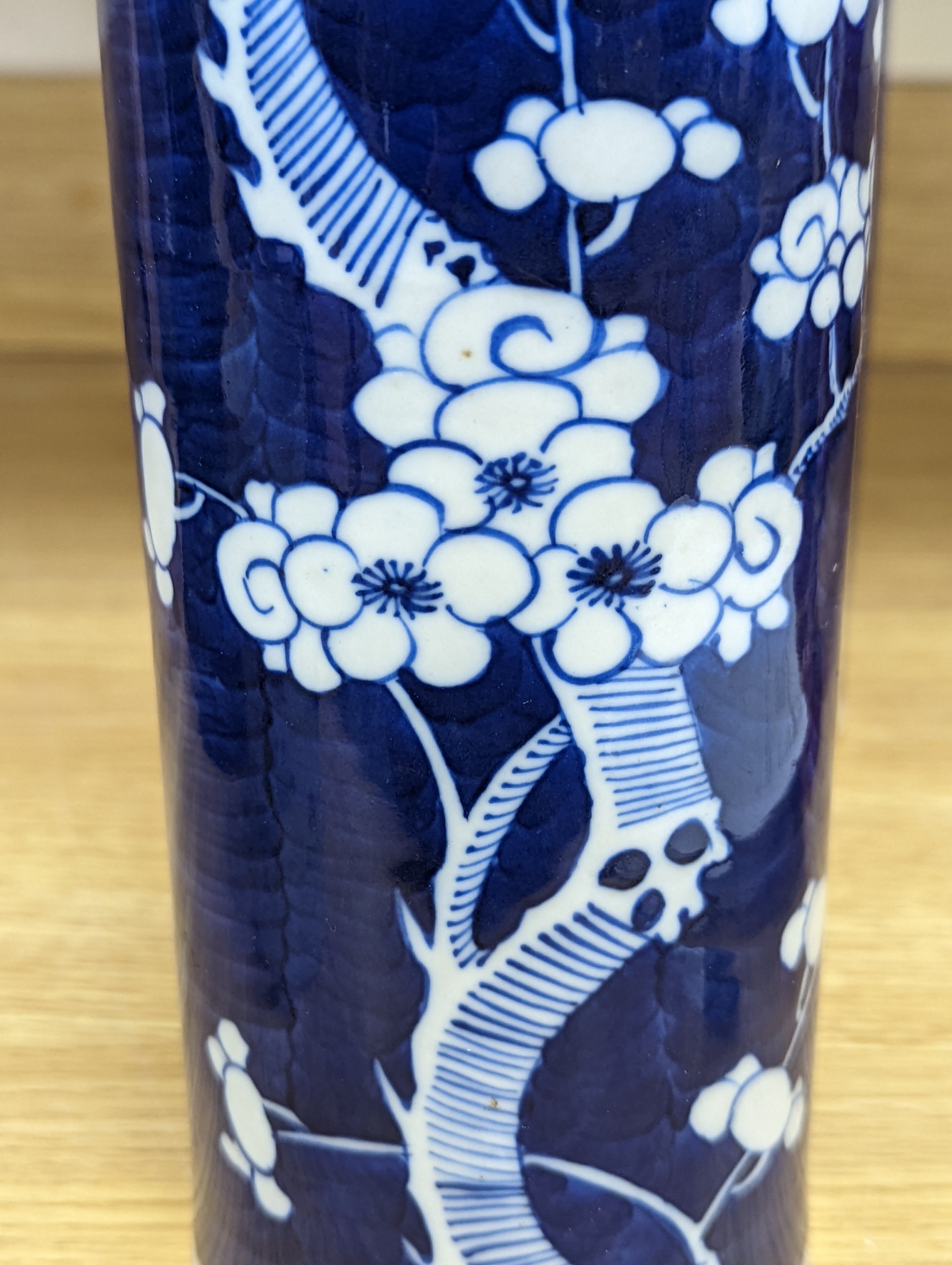 An 18th century Chinese famille rose mug, a Chinese Imari tea caddy and two Chinese blue and white sleeve vases 30cm (4)